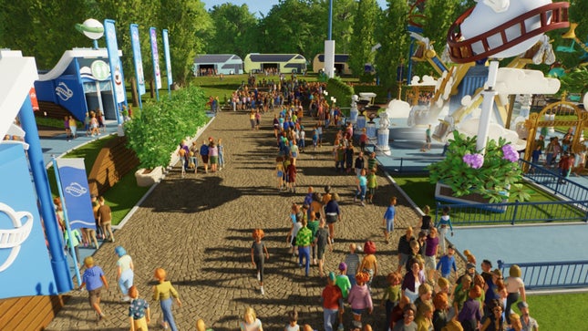 Visitors walk through a new theme park in 